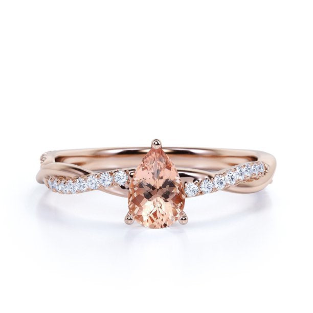 0.75 ct Pear Shaped Morganite and Moissanite Twist Wedding Ring in 18K Rose Gold over Silver