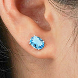 2.5 Carat Oval Cut - Blue Topaz - December Birthstone Solitaire Stud Earrings - 4 Prong - In 18K White Gold Plating Over Silver