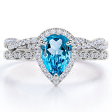 1.5 Carat Pear Cut December Birthstone Blue Topaz and Moissanite Vintage Engagement Ring - Halo Pave Bridal Set in 18K White Gold Over Silver