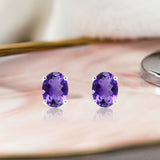 2.5 Carat Oval Cut - Amethyst - February Birthstone Solitaire Stud Earrings - 4 Prong - In 18K White Gold Plating Over Silver