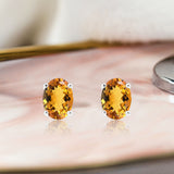 2.5 Carat Oval Cut - Citrine - November Birthstone Solitaire Stud Earrings - 4 Prong - In 18K White Gold Plating Over Silver