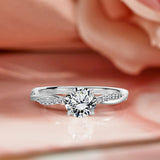 Cathedral Prong 1.25 Carat Round Shaped Moissanite Half Pave Infinity Twisted Shank Engagement Ring In 18K White Gold Plating Over Silver