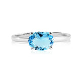 1.25 Carat Oval Cut Blue Topaz SWAROVSKI - December Birthstone Solitaire Engagement Ring in 18k White Gold Over Silver