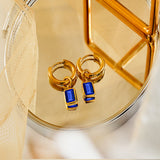 2 Carat Emerald Cut - Blue Sapphire - September Birthstone Bezel Huggie Hoop Earrings - 18K Yellow Gold Plating