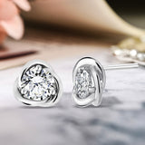 Certified Half Carat TCW Round Cut Certified Lab Diamond Petite Twist Stud Earrings in 18k White Gold over Silver