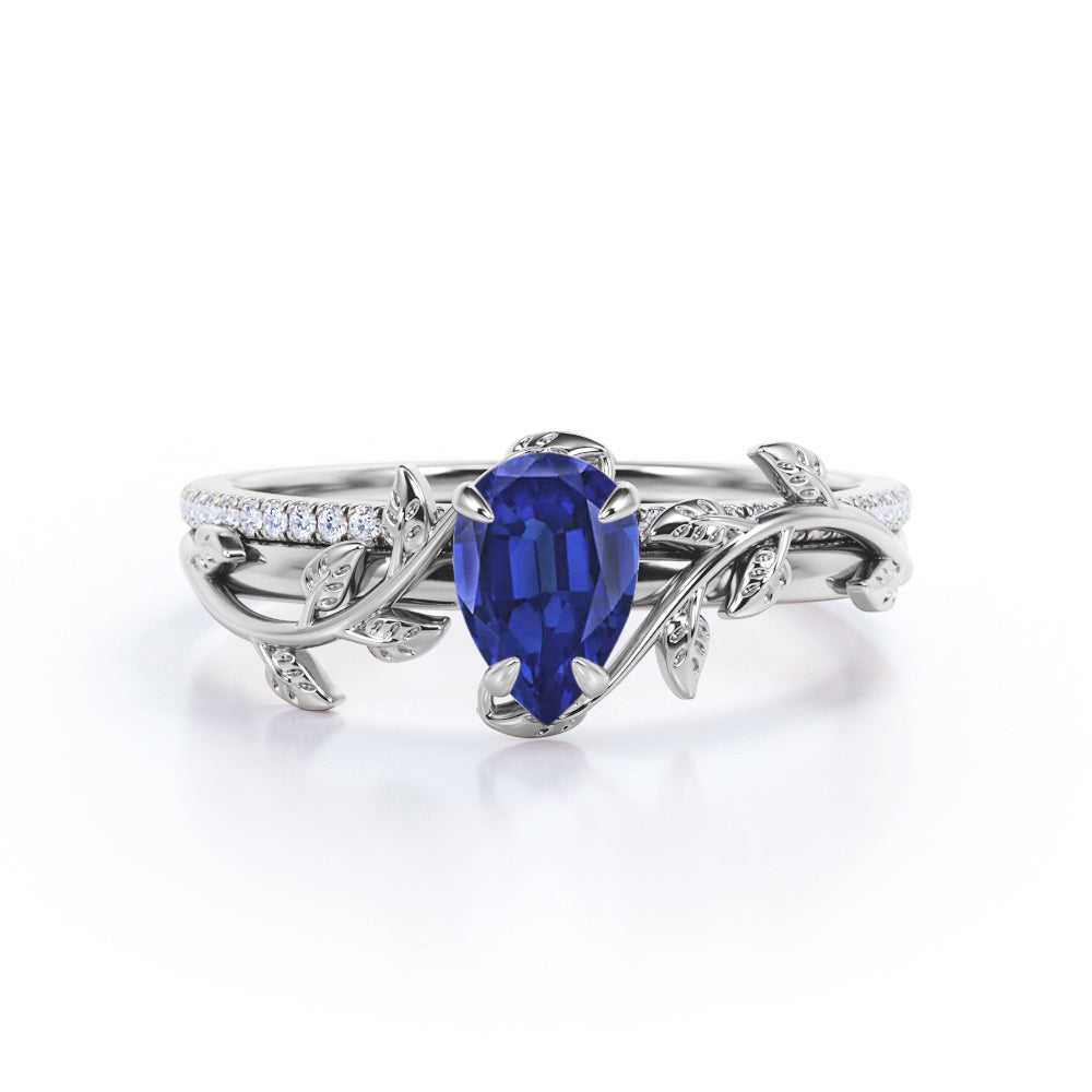 Pave style 1.25 carat Pear Cut Lab-Created Sapphire and Diamond floral wedding ring set in White Gold