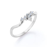 Prong Cluster 0.10 TCW Pear and Round Cut Moissanite Curved Wedding Band in White Gold