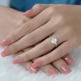 1.10 Ct Pear Moissanite Tapered Side Stone Engagement Ring