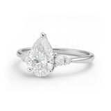 1.10 Ct Pear Moissanite Tapered Side Stone Engagement Ring