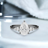 1.10 Ct Pear Moissanite Tapered Side Stone Engagement Ring