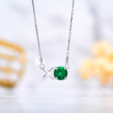 Modern 1.25 TCW Round Cut - Emerald - May Birthstone Floating XO Pendant Necklace in 18K White Gold over Silver