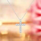 Shared-Prong 0.10 TCW Round Shape Moissanite Pave Style Cross Pendant Necklace in 18K White Gold Plating over Silver