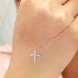 Shared-Prong 0.10 TCW Round Shape Moissanite Pave Style Cross Pendant Necklace in 18K White Gold Plating over Silver