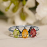 Trio Custom Birthstone Pear cut Engagement ring for women in 18k white gold over silver