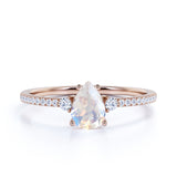 Surface Prong Set 1.50 Carat Pear White Blue Moonstone and Diamond Engagement Ring in Rose Gold