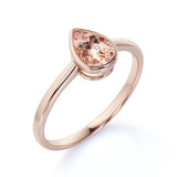 Traditional 1.25 Carat Pear Shaped Orange Peach Morganite and Solitaire Engagement Ring in Rose Gold