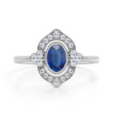 Huge 2 Carat Oval Shaped Dark Blue Sapphire and Diamond Antique Engagement Ring in White Gold