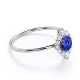 Elegant 0.75 Carat Round Dark Blue Sapphire and Diamond Halo Dainty Engagement Ring in White Gold