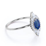 Petite 0.80 Carat Oval Shape Royal Blue Sapphire and Diamond Cluster Engagement Ring in White Gold