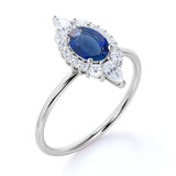 Petite 0.80 Carat Oval Shape Royal Blue Sapphire and Diamond Cluster Engagement Ring in White Gold