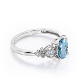 Swirly 0.5 carat Oval Aquamarine and Diamonds Antique Engagement Ring in Rose Gold