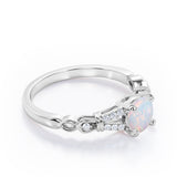 Split Shank 0.6 carat Round Opal and Diamond Engagement Ring in Rose Gold