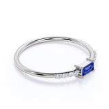 Dainty East West 0.45 Carat Emerald Cut Dark Blue Sapphire and Pave Diamond Engagement Ring in White Gold