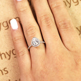 1.50 Carat Pear Cut Moissanite and Diamond Halo Engagement Ring in White Gold