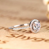 1.50 carat Round Brilliant Moissanite Halo Engagement Ring in 18k White Gold over Silver