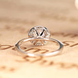1.50 carat Round Brilliant Moissanite Halo Engagement Ring in 18k White Gold over Silver