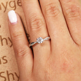 Cathedral Prong 1.25 Carat Round Shaped Moissanite Half Pave Infinity Twisted Shank Engagement Ring In 18K White Gold Plating Over Silver