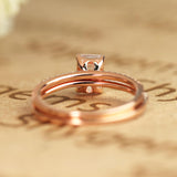 1.50 Carat emerald cut Moissanite and Diamond Halo Bridal Set in 10k Rose Gold