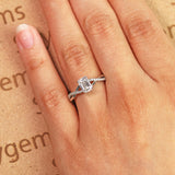 1.25 Carat emerald cut Moissanite and Diamond Solitaire Infinity Engagement Ring in 10k White Gold