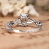 1.25 Carat emerald cut Moissanite and Diamond Solitaire Infinity Engagement Ring in 10k White Gold