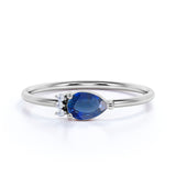 Beautiful East West Pear Navy Blue Sapphire and Diamond Minimalist Engagement Ring in White Gold