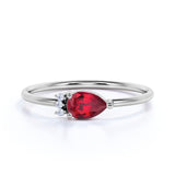 Beautiful East West Pear Ruby and Diamond Minimalist Engagement Ring in White Gold