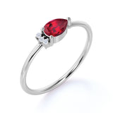 Beautiful East West Pear Ruby and Diamond Minimalist Engagement Ring in White Gold