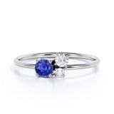 Mini Asymmetric Round Shape Midnight Blue Sapphire and 3 Stone Diamond Engagement Ring in White Gold