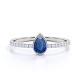 Petite Bezel Set Teardrop Vivid Blue Sapphire and Fishtail Diamond Engagement Ring in White Gold