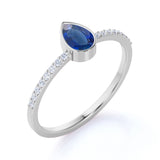 Petite Bezel Set Teardrop Vivid Blue Sapphire and Fishtail Diamond Engagement Ring in White Gold