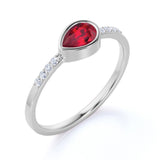 Dainty Bezel 0.75 Carat Pear Lab Ruby and Diamond East West Engagement Ring in White Gold