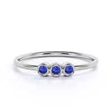Classic Trilogy Round Shaped Dark Blue Lab-Created Sapphire and Minimalist Bezel Stackable Ring Band in White Gold