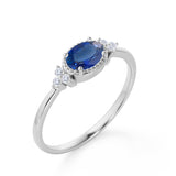 Unique East West 1.40 Carat Oval Cut Dark Blue Sapphire and 7 Stone Diamond Engagement Ring in White Gold