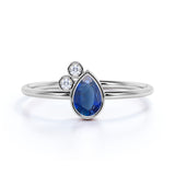 Minimalist 0.60 Carat Pear Shaped Peacock Blue Sapphire and 3 Stone Diamond Vintage Engagement Ring in White Gold