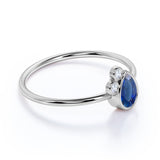 Minimalist 0.60 Carat Pear Shaped Peacock Blue Sapphire and 3 Stone Diamond Vintage Engagement Ring in White Gold