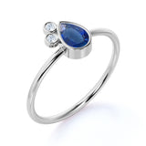Minimalist 0.60 Carat Pear Shaped Peacock Blue Sapphire and 3 Stone Diamond Vintage Engagement Ring in White Gold