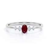 Dainty Oval Shape Ruby and 5 Stone Diamond Tapered Shank Engagement Ring in White Gold