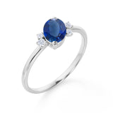 Unique 1.85 Carat Oval Cut Midnight Blue Sapphire and Diamond Asymmetrical Engagement Ring in White Gold