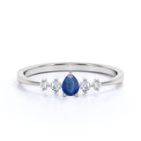 Petite 0.49 Carat Pear Vivid Blue Sapphire and 5 Stone Diamond Tapered Shank Engagement Ring in White Gold