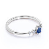 Petite 0.49 Carat Pear Vivid Blue Sapphire and 5 Stone Diamond Tapered Shank Engagement Ring in White Gold